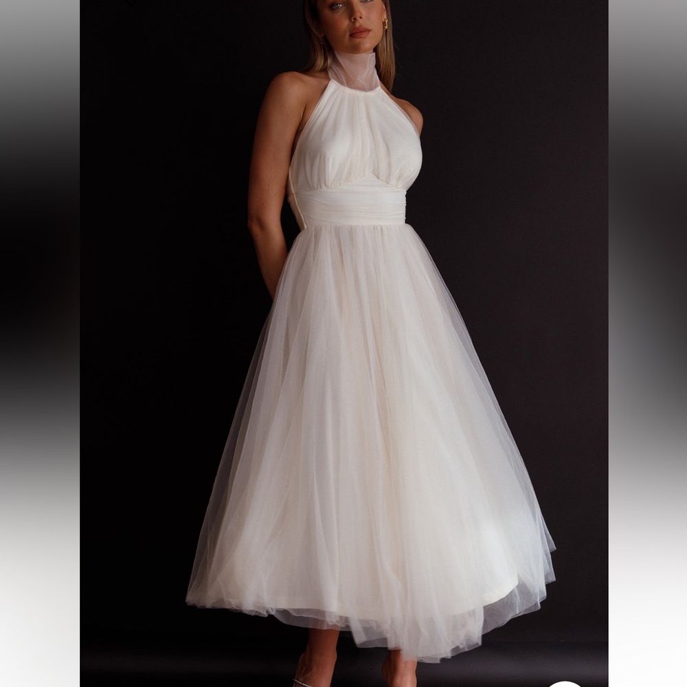 Ivory midi tool dress. I’m 5’2 so it’s long on me. Worn once for these pictures.
